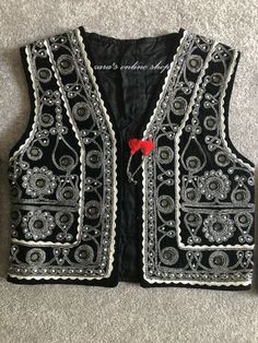 "Here is an Afghan Kuchi Pashtun men handmade zari gold and silver embroidery work vest waistcoat. Traditionally such vests are used on special events like wedding Nikah and Mehndi event. Available in small, medium and large size. It contains very beautiful golden color threads embroidery work which is traditionally called \"Zari or Tilai\" embroidery work. Fabric is long lasting, comfortable and breathable." Elegant Embroidered Festive Vest, Traditional Embroidered Festival Vest, Traditional Embroidered Festive Vest, Traditional Embroidered Vest For Festivals, Traditional Festive Vest With Intricate Embroidery, Festive Bohemian Vest With Intricate Embroidery, Festival Vest With Intricate Embroidery, Festive Embroidered Vest For Festivals, Traditional Fitted Vest With Intricate Embroidery