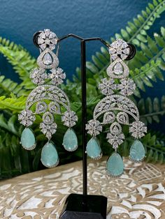 Rhodium plated earring with Cz stone work. About 4 inch long . American diamond push back super light weight. Carved stone detail. Clip back Carved Stone, Cz Earrings, Stone Work, American Diamond, Stone Carving, Cherry Red, Cz Stone, Blue And Silver, Rhodium Plated