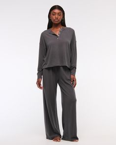 Slim-fitting long-sleeve henley top in our soft cozy lounge fabric and oversized-fit silhouette, featuring a button-up neckline and all-over textured detail. Gray Long Sleeve Casual Sleepwear, Relaxed Fit Long Sleeve Sleepwear For Fall, Casual Long Sleeve Sleepwear For Fall, Casual Long Sleeve Solid Color Top For Loungewear, Casual Long Sleeve Top For Loungewear, Henley Loungewear For Fall, Fall Henley Neckline Loungewear Tops, Versatile Long Sleeve Top For Fall Loungewear, Relaxed Fit Henley Neckline Tops For Loungewear