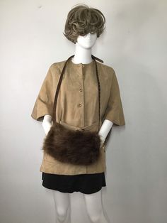 "Brown women's muff, made from real beaver fur, soft and velvet fur with long pile, comfort muff, warm muff, cinema style muff, Red carpet muff, wedding muff, party muff, bride muff, theatre muff, show muff, vintage style, retro style, has size medium. Women's amazing muff; made from real beaver fur; fur is soft and genuine, with shiny long pile; warm, broad, comfortable muff - brown color. Fashionable muff, perfectly representing the function of warming and decoration; has leather belt - can be Brown Faux Fur Coat With Feather Trim, Red Fur, Mens Black Jacket, Retro Jacket, Festive Look, Vintage Style Wedding, Fur Scarf, Black Scarf, Warm Scarf