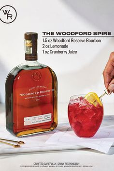 a bottle of woodford spirit with a glass filled with liquid