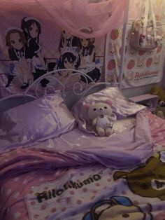 there is a teddy bear on the bed in this room with pink sheets and pillows