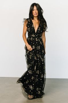 Check out the Natalia Floral Embellished Maxi Dress in Black and Gold! This dress is absolutely stunning and will leave you feeling gorgeous! Winter Wedding Guest Dress Lulus, Full Figure Formal Dresses, Boho Black Tie Dress, Women’s Formal Dresses, What To Wear To A Black Tie Event Women, Fall Floral Dresses, Gold And Black Wedding Dress, Black Tie Optional Wedding Guest Dress Fall, Black Formal Dress Outfit