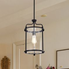 a light fixture hanging from the ceiling in a living room