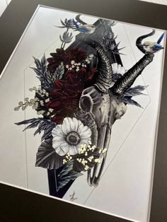 a drawing of a bull skull with flowers and birds on it's back side