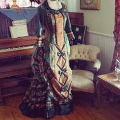 Bold plaid taffeta promenade gown with matched plaid ruffles and ruches, shirred chiffon front inset and knife pleated hem a la mode of 1876. Final fitting was at our historic home in Tombstone, AZ...the perfect setting for this Lily Absinthe original. Knife Pleat, Hands On