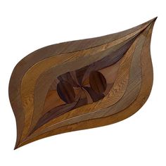 a wooden object that looks like an abstract design