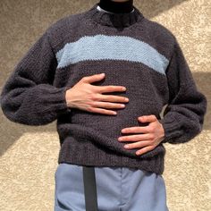 a man with his hands on his stomach