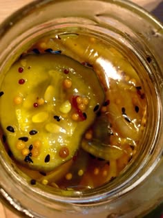 a glass jar filled with food sitting on top of a table