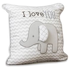 a gray and white pillow with an elephant on it's back that says i love you