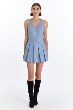 Meet the Niall Skort Romper—a chic blend of classic and contemporary. This vest-top skort romper features a pleated skirt layered over self-fabric shorts, creating the illusion of a stylish two-piece outfit. With five buttons down the center front and an invisible zipper at the wearer's left side seam, it offers a seamless look and easy wear. The Niall Skort Romper is perfect for making a refined statement with a playful twist. Style Details: Vest Top Skort Romper Pleated Skirt Self Fabric Short Preppy Fitted Mini Dress For Summer, Fitted Preppy Mini Dress For Summer, Formal Spring Mini Skort, Formal Spring Mini Length Skort, Preppy Fitted Mini Dress For Spring, Fitted Preppy Mini Dress For Spring, Classic Fitted Summer Skort, Classic Fitted Skort For Summer, Fitted Accordion Pleated Shorts For Summer