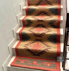 a carpeted stair runner on the side of a set of stairs