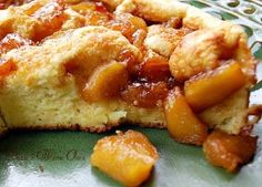 a close up of a piece of pie on a plate with some fruit toppings