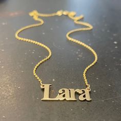 "Handmade 14k solid yellow gold necklace with a custom name pendant of your choosing, layered necklace for women.  This 14k yellow gold necklace truly has your name on it!  This necklace is light and classic, perfect for everyday use. This simple yet sophisticated design will compliment any look you choose. You can wear it as a single, minimalist necklace or layered with more necklaces for a total bohemian look.  Add a little BLING to your everyday look with this shiny solid gold necklace. Featu Customized Yellow Gold Sterling Silver Name Necklace, Customized 14k Yellow Gold Necklace, Gold Initial Pendant Name Necklace Customizable, Custom Name Gold Necklace In Sterling Silver, Gold Custom Necklace With Initial Pendant, Customizable Gold Initial Pendant Name Necklace, Customizable Gold Initial Pendant Necklace, Personalized Gold Name Necklace With Initial Pendant, Custom Name Sterling Silver Necklace In Gold