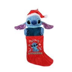 a stuffed animal in a christmas stocking with the words merry stitchmas on it