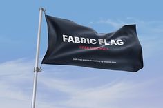 a black fabric flag flying in the sky with a free mockup message on it