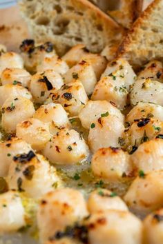 some shrimp and bread are on a plate