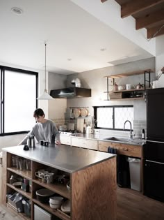 a kitchen with wooden cabinets and stainless steel appliances