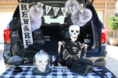 a car with skeleton decorations in the trunk