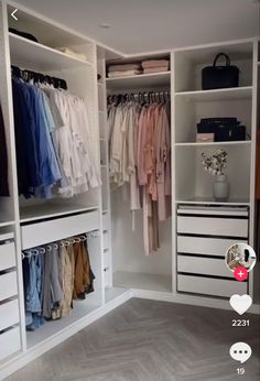 an open closet with clothes hanging on the walls and drawers in front of it,