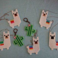 some llamas and cactuses are made out of perler beads