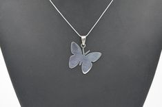 "Butterfly Symbol Necklace A wonderful gift idea for any butterfly lover. It symbolizes growth and new beginnings. Made from Stainless Steel Colour: Silver You may choose to purchase just the pendant or the complete necklace. There are 2 chains to choose from (both made from stainless steel) as well as a wax cord necklace option: - Trace link chain (50.5cm / 19.88\" or 40cm / 16\") - Snake chain (49cm / 19.30\" or 40cm / 16\") - Black wax cord (45cm / 17.71\") with adjustable length chain of 5cm / 2\". The pendant itself measures approx. 3.5cm / 1.1\" across Please note that this is not an official trademarked product." Everyday Nickel-free Butterfly Jewelry, Minimalist Sterling Silver Butterfly Pendant Necklace, Sterling Silver Butterfly Necklace With Charm As Gift, Silver Butterfly Pendant Necklace Gift, Silver Butterfly Pendant Necklace As A Gift, Silver Butterfly Pendant Necklace For Gift, Minimalist Butterfly Pendant Necklace, Handmade Minimalist Butterfly Jewelry, Personalized Butterfly Silver Necklaces