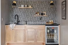 a kitchen with wooden cabinets and black counter tops