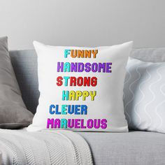 a pillow that says funny, handsome and strong with the words happy clever on it