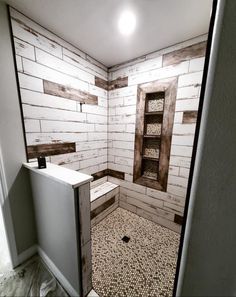 a bathroom with white brick walls and flooring