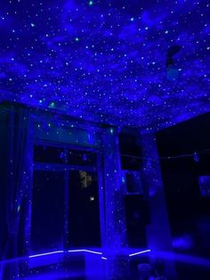 the ceiling is covered in blue lights and stars