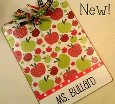 this is an image of a teacher's name tag with apples and polka dots