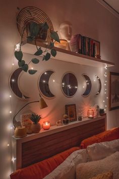 a bedroom with several mirrors and lights on the wall