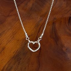 This sterling silver box chain necklace features a secure front closing open heart clasp, perfect for everyday wear. Its minimalist design and high-quality construction makes it a great choice for both formal and casual occasions. Details: Chain: Solid Sterling Silver rounded box chain, 1.8mm width Clasp: Solid sterling silver open heart hinged push clasp, 13.5mm, front closure Lengths: 16” to 36” choose your length in the drop down menu Shipping: Free shipping in the USA Ready to ship within on Sterling Silver Box Chain Necklace For Everyday, Everyday Sterling Silver Box Chain Necklace, Everyday Heart Shaped Box Chain Necklace, Silver Open Heart Chain Necklace With Charm, Everyday Heart-shaped Box Chain Necklace, Sterling Silver Open Heart Necklace With Adjustable Chain, Everyday Open Heart Chain Necklace, Open Heart Chain Necklace Gift, Everyday Heart Pendant Box Chain Jewelry