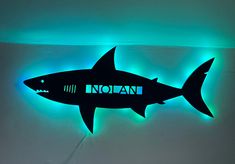 Personalized Great White Shark with or without lights This kids Great White Shark is personalized with your littles name. It can either used as a bedroom door hanger, nightlight or wall art for any room. You can choose with or without lights. Lights are fairy lights and will already be attached for easy set up. These lights are dual with battery operated and well as USB hook up to be able to be mounted anywhere even if you don't have an outlet nearby. Each sign will be ready for hanging 1/2 thic Shark And Dinosaur Bedroom, Kids Shark Room, Shark Boys Bedroom, Toddler Shark Room, Kids Shark Bedroom, Shark Theme Nursery, Boys Shark Room, Shark Bedroom Boys, Boys Shark Bedroom