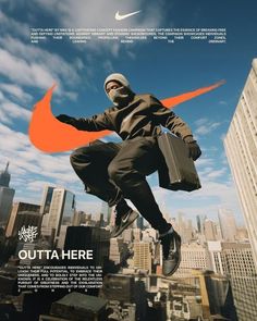 a man jumping in the air while holding a briefcase and wearing a nike hoodie