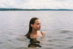 a woman is swimming in the water