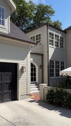 a house with two garages and an umbrella