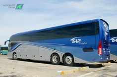 two buses parked next to each other in a parking lot