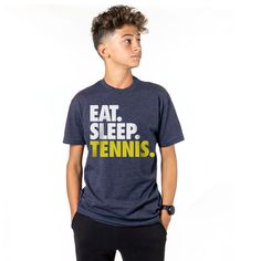 a young man wearing a t - shirt with the words eat sleep swim on it