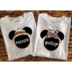 two tshirts with mickey and minnie mouse heads on them, one is wearing a hat