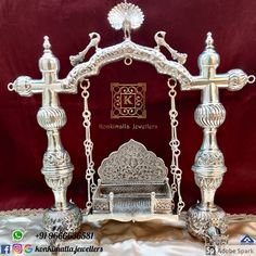 an ornate silver altar with two crosses on it