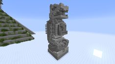 an image of a statue made out of rocks and grass in minecraft, with another one behind it