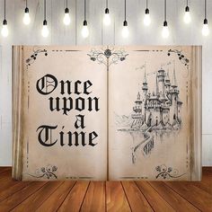 an open book with the words once upon a time written on it in black ink