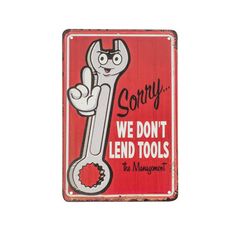 a red sign that says sorry we don't lend tools with a wrench on it