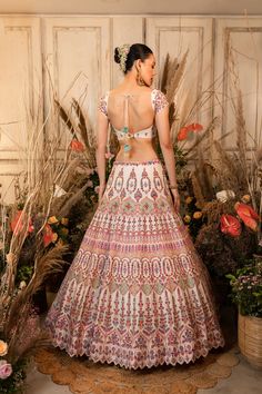 This playful lehenga is intricately embroidered with multi-hued resham threads, sequins, and glass beads and is paired with a matching blouse and mauve-pink organza dupatta.by Chamee and Palak. DELIVERY TIMEPlease allow 4-6 months for your outfit to arrive. FABRIC DETAILSRaw silk, Organza Pink Chandbali Choli With Intricate Embroidery, Pink Chanderi Dress With Intricate Embroidery, Bohemian Saree With Resham Embroidery For Reception, Festive Multicolor Gown With Intricate Embroidery, Pink Chanderi Lehenga With Intricate Embroidery, Multicolor Embroidered Anarkali Set With Mirror Work For Reception, Pink Tissue Silk Choli With Resham Embroidery, Bohemian Wedding Lehenga With Resham Embroidery, Multicolor Gown With Intricate Embroidery For Designer Wear