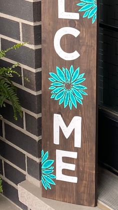 a wooden sign that says welcome to the home