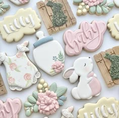 many decorated cookies are displayed on a white surface with the word happy written above them