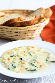 a bowl of chicken grout soup with bread in the background and text overlay