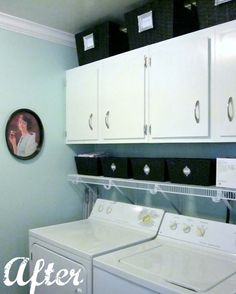 a white washer and dryer sitting next to each other in a laundry room