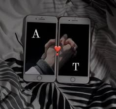 two cell phones with the letters s and r on them